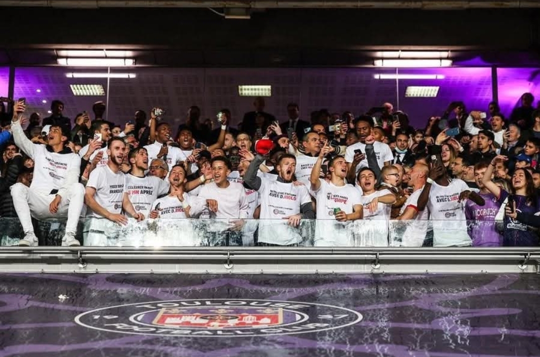Fans celebrating a title win in the stadium